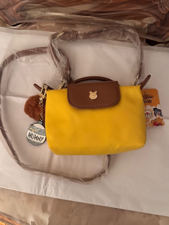 Disney Handbags - New Disney Yellow & Brown Mini Winnie the Pooh Crossbody Bag w/Bag Charm